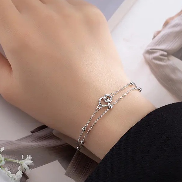 Dámský stříbrný dvojitý náramek se spojenými kroužky a zirkony